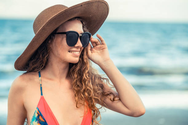 istock Happy young woman at beach in summer vacation. 1011668012