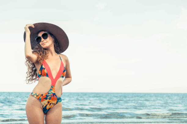 istock Happy young woman at beach in summer vacation. 1011668052
