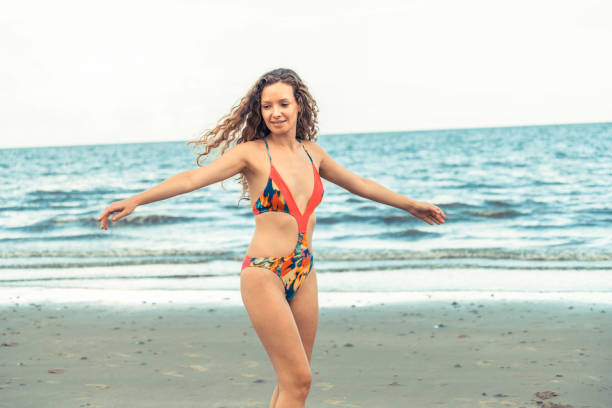 istock Happy young woman at beach in summer vacation. 1011668068