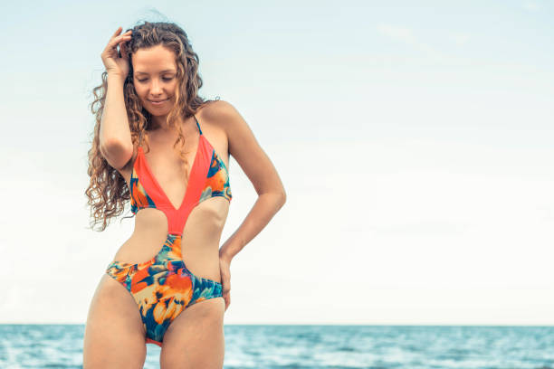 istock Happy young woman at beach in summer vacation. 1011668122