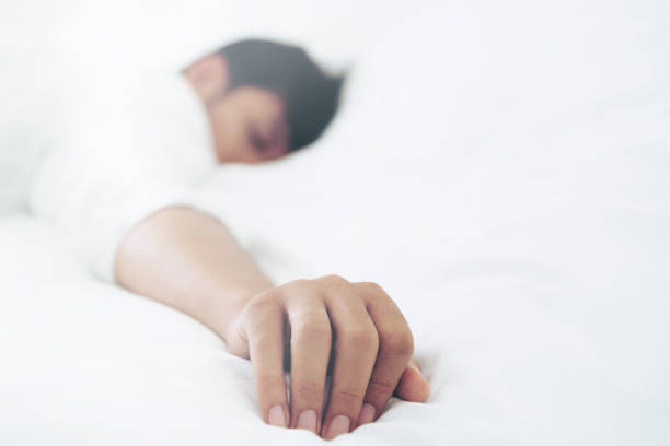 istock Young man sleep in bed in the bedroom. 1011672706