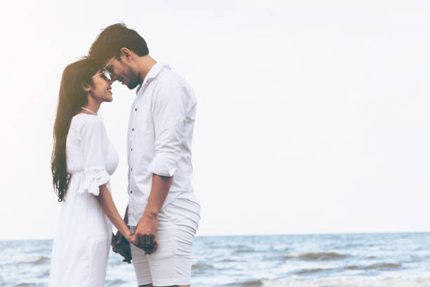 istock Couple going honeymoon on tropical beach in summer 1011672728
