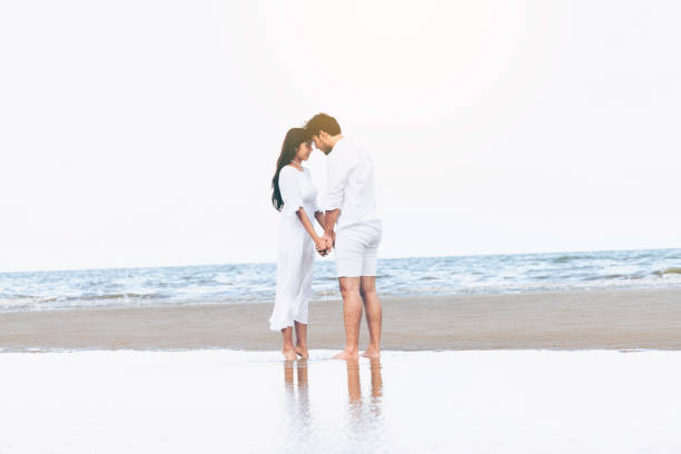 istock Couple going honeymoon on tropical beach in summer 1011672758
