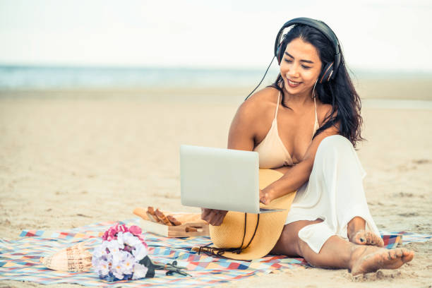 istock Plus size young woman sitting on the beach. 1011673222