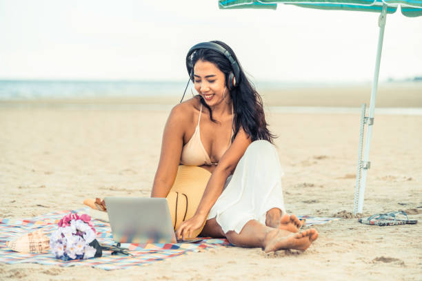 istock Plus size young woman sitting on the beach. 1011673242