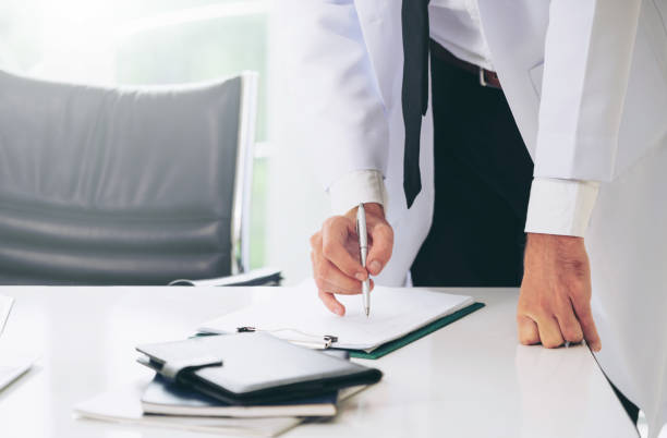 istock Young man doctor working at office in hospital. 1011675646