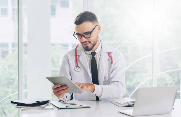 istock Doctor working on tablet computer in the hospital. 1011675664