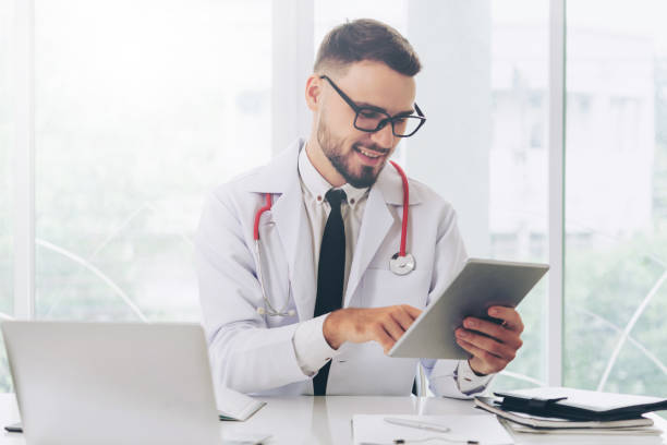 istock Doctor working on tablet computer in the hospital. 1011675684