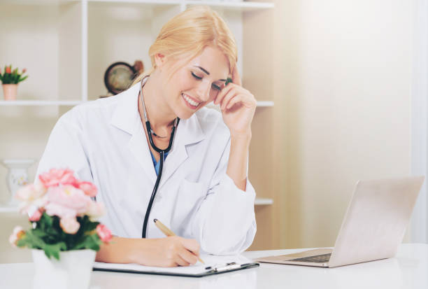 istock Young female doctor working in hospital office. 1011680896