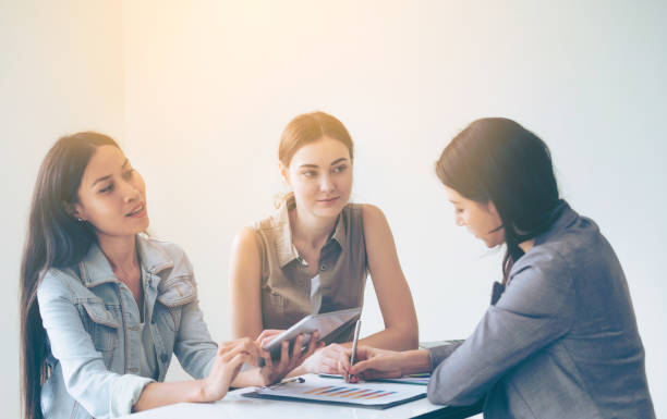istock Multicultural businesswomen in group meeting. 1011683082