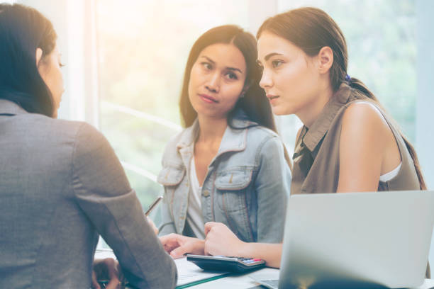 istock Multicultural businesswomen in group meeting. 1011683146