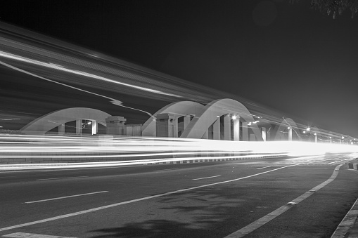 Wide view of napier bridge arch shaped design.long exposure photograph with light trails of moving vehicles in black and white color One of the oldest bridge over cooum River