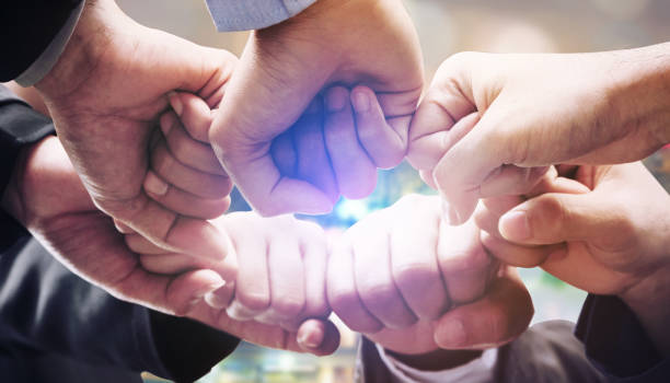 istock Business people team joining hands. 1011683160