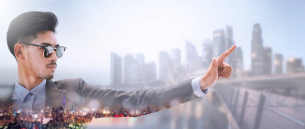 istock Businessman pointing at copy space for your text. 1011683314