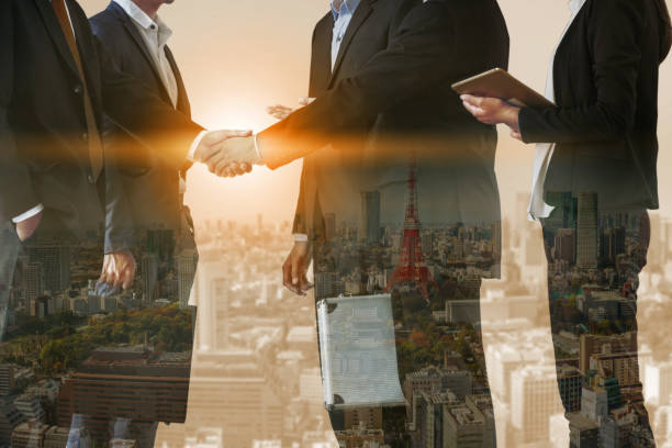 istock Double exposure Business People Handshake Meeting 1011683418