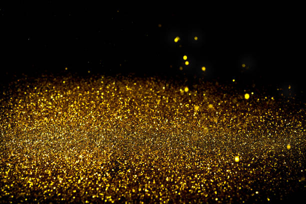 istock Sprinkle glitter gold dust in the dark textured abstract background elegant for Merry christmas and Happy new year 1011683600