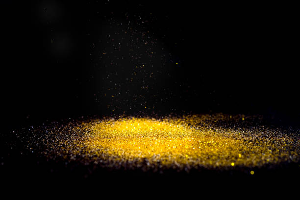 istock Sprinkle glitter gold dust in the dark textured abstract background elegant for Merry christmas and Happy new year 1011683630
