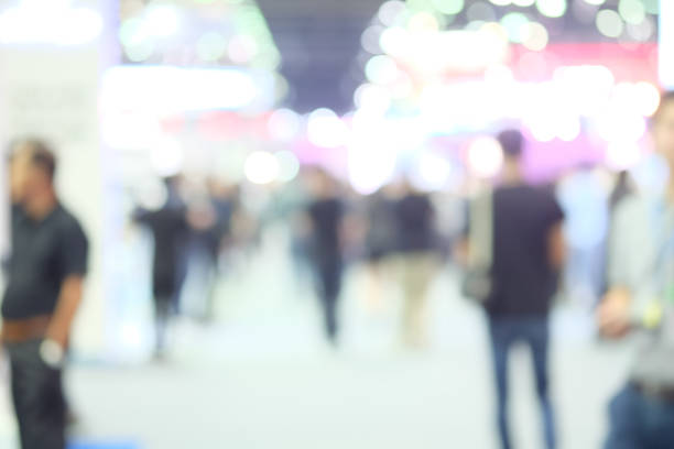 istock Abstract background blurred many people in the exhibition event. 1011690520