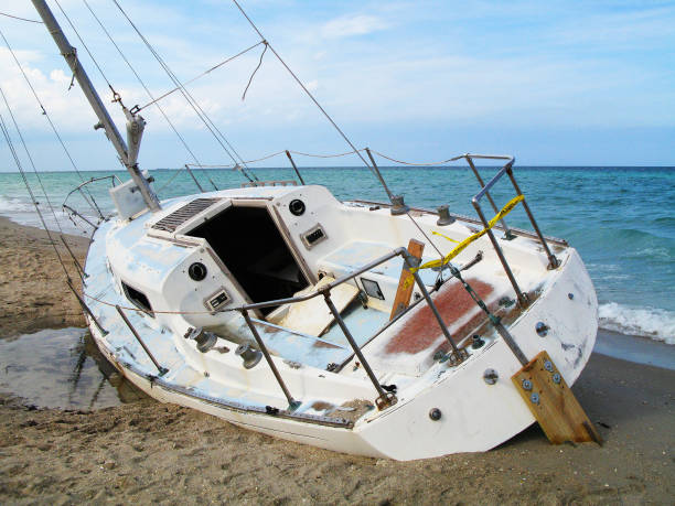 istock Adandoned Sailboat at the Beach 1011690570