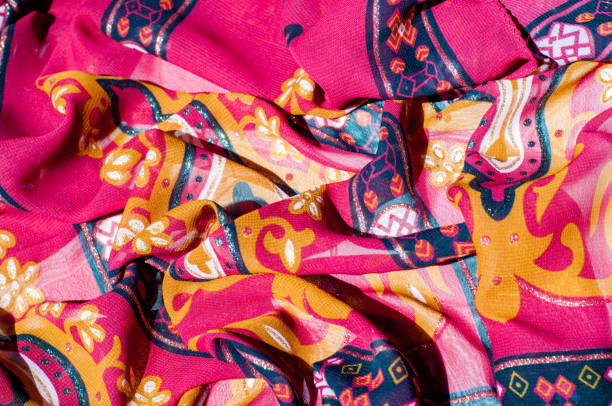 istock Background texture, pattern. Red maroon fabric. Click on your local heritage with this red, bard and yellow striped silk. This patterned fabric will decorate your design. your work will be exclusive 1011690594