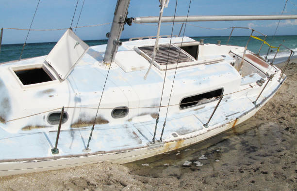 istock Adandoned Sailboat at the Beach 1011690650