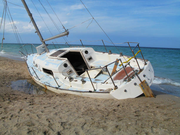 istock Adandoned Sailboat at the Beach 1011690734