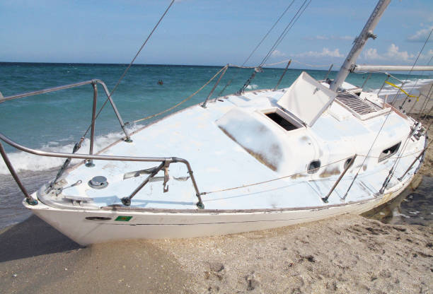 istock Adandoned Sailboat at the Beach 1011691098