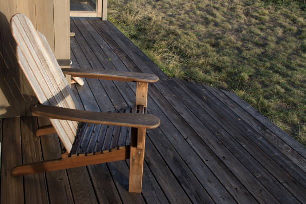 istock Chair on wooden terrace in sunlight 1011694636