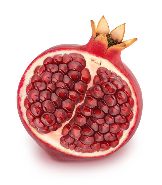 istock Halved pomegranate isolated on a white. 1011704118