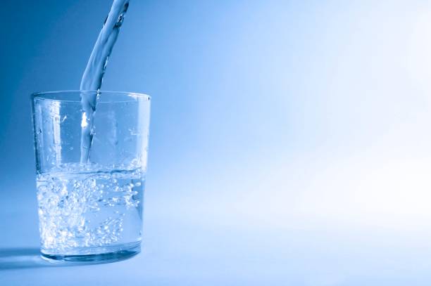 istock Glass of water in blue 1011711466