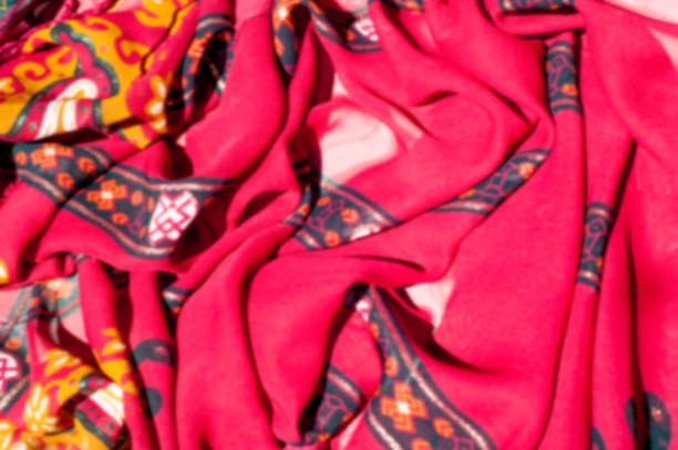 istock Background texture, pattern. Red maroon fabric. Click on your local heritage with this red, bard and yellow striped silk. This patterned fabric will decorate your design. your work will be exclusive 1011715432