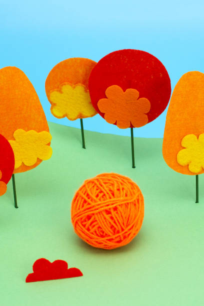 istock Bright orange yellow warm yarn for knitting 1011718180