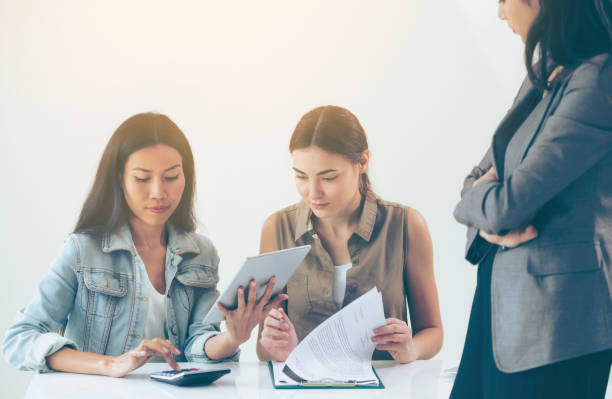 istock Multicultural businesswomen in group meeting. 1011718464