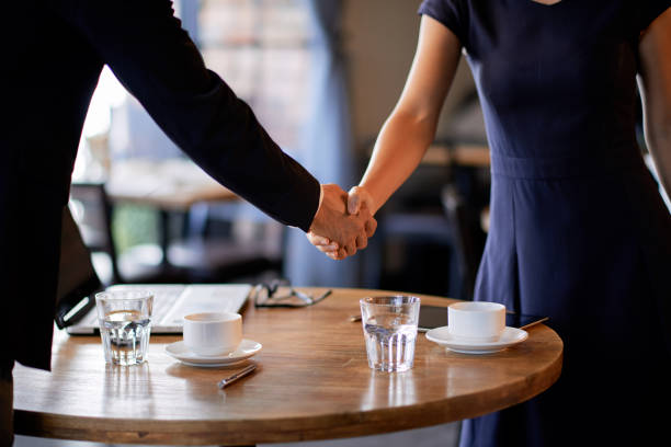Handshake Over Tea 2,300+ Handshake Restaurant Stock Photos, Pictures & Royalty-Free ...