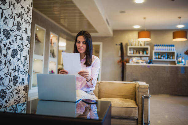 istock Business women working in lobby bar, using laptop 1011724046