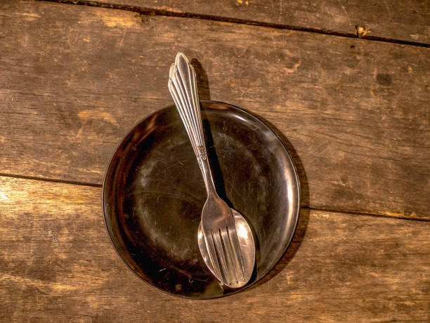 istock Cultery on the ptate on wooden background 1011724452