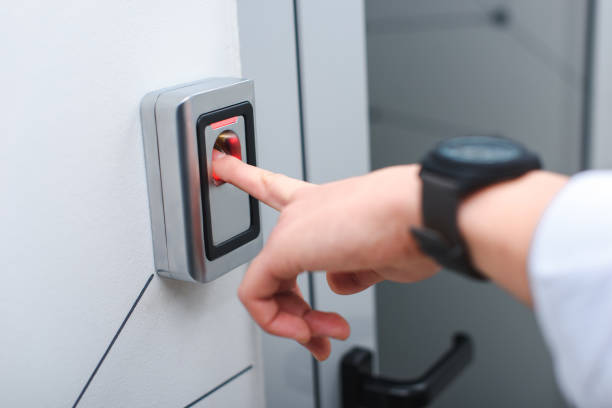 istock cropped image of man with wristwatch pushing button of elevator 1011724478