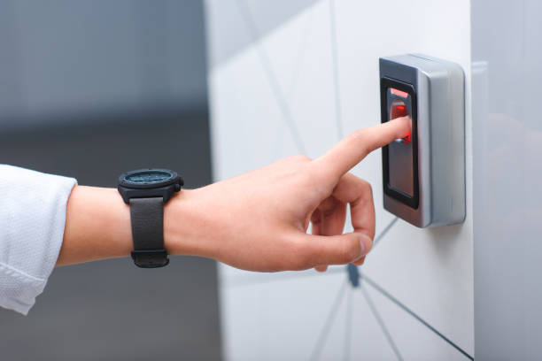 istock cropped image of man with wristwatch pushing button of elevator 1011724490