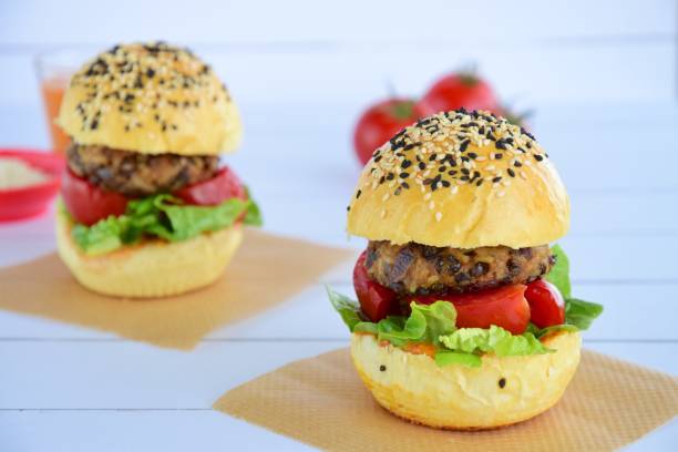 istock Sesame burger bun with lentil patty, tomato and lettuce 1011728394