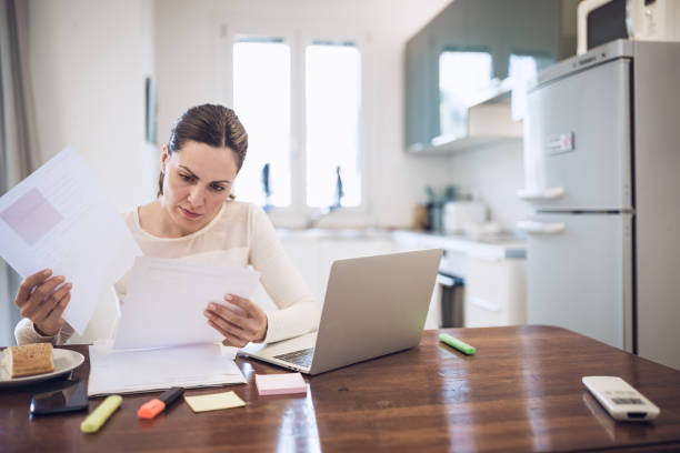 istock Worried young women working at home, using laptop 1011729130