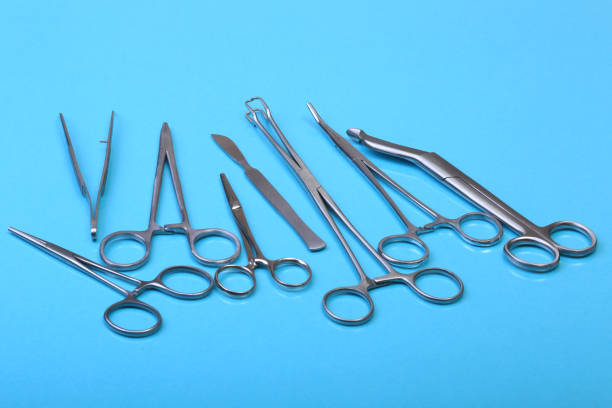 istock Close Up Surgical instruments and tools on blue mirror background. Selective focus. 1011734488