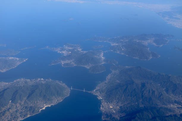 istock an Aerial view of plane window looking down to land 1011737714