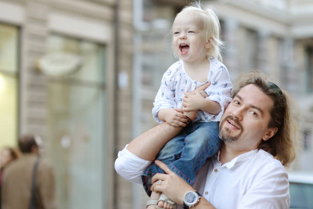 istock Young father holding his little girl 1011738100