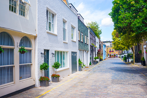 Exclusive mews with colored luxury residential houses in Marylebone, a weatlhy borough of central London