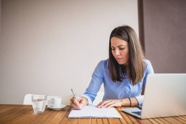 istock Young businesswomen working at cafe, using laptop, preparing for meeting 1011743612