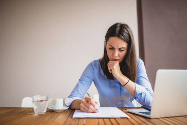 istock Young businesswomen working at cafe, using laptop, preparing for meeting 1011743616