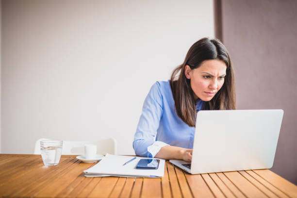 istock Young businesswomen working at cafe, using laptop, preparing for meeting 1011743624