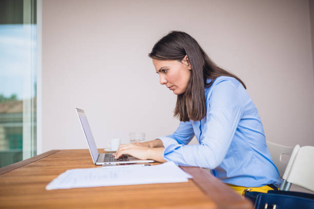 istock Young businesswomen working at cafe, using laptop 1011743660