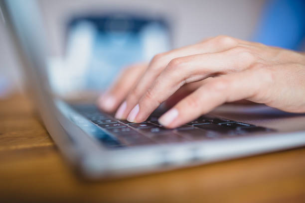 istock Close-up female hands typing on laptop keyboard 1011743716