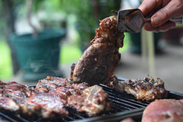 istock Cooking meat on a grill 1011750566